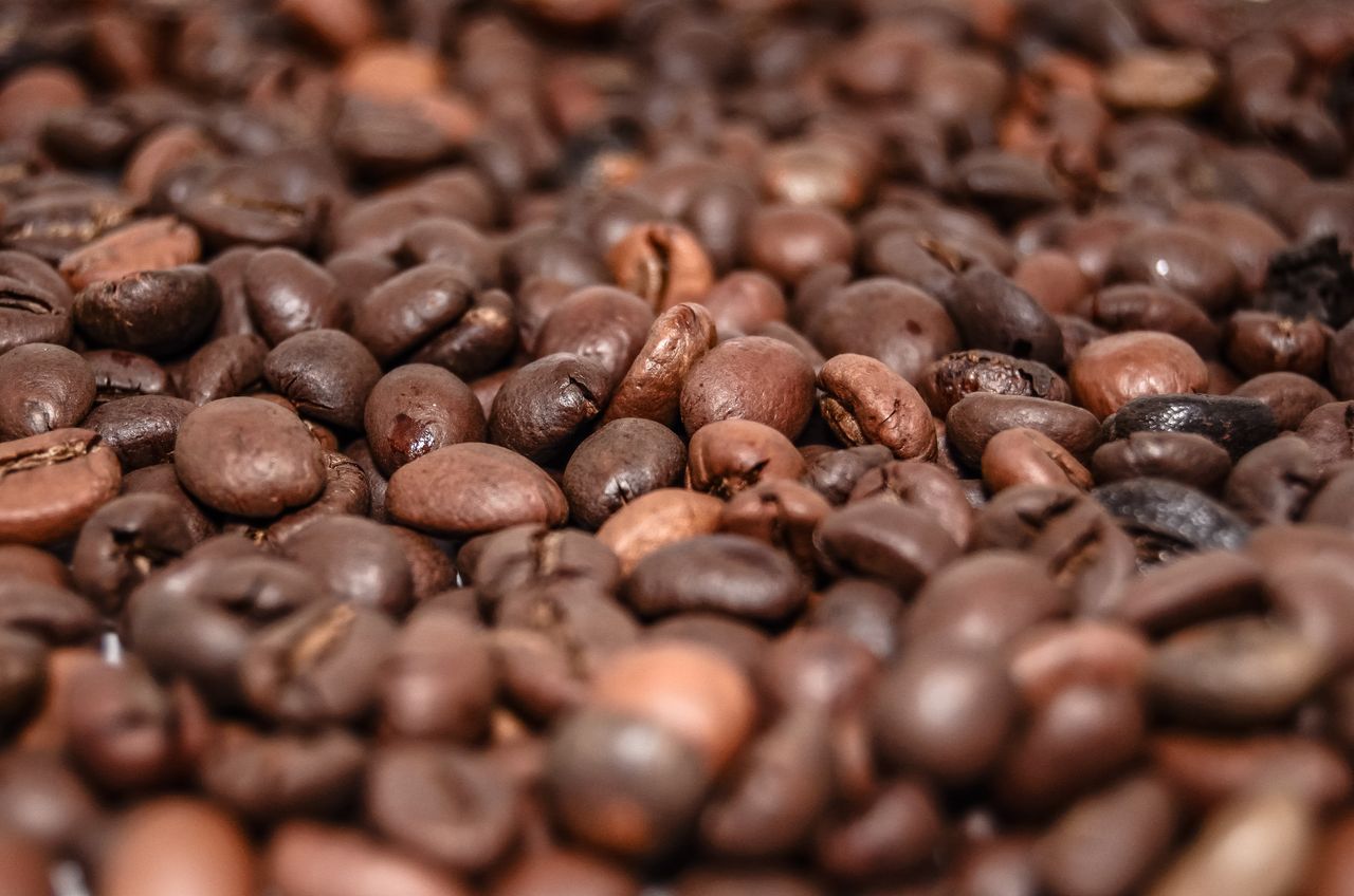 High-resolution macro shot of brown coffee beans, perfect for coffee-themed projects.
